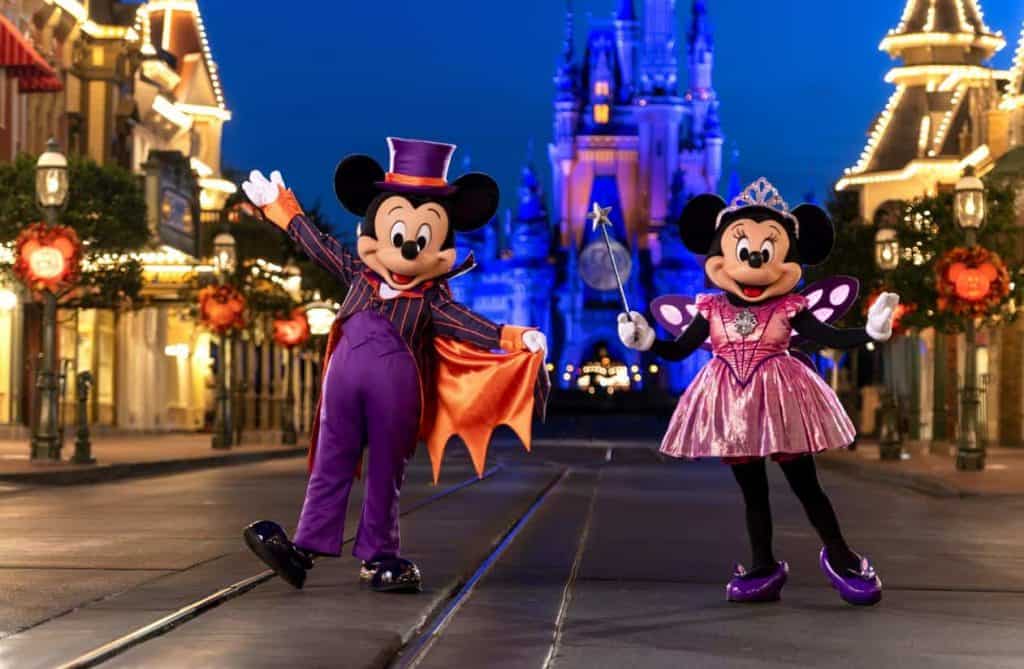 Mickey and Minnie at Mickey's Not So Scary Halloween Party in front of Cinderella Castle at Magic Kingdom